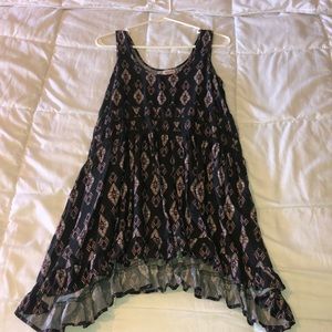 Patterned black dress with pink design.